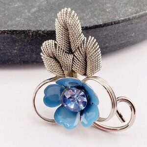 VINTAGE Silver tone metal, blue enamel, and blue rhinestone flower brooch pin